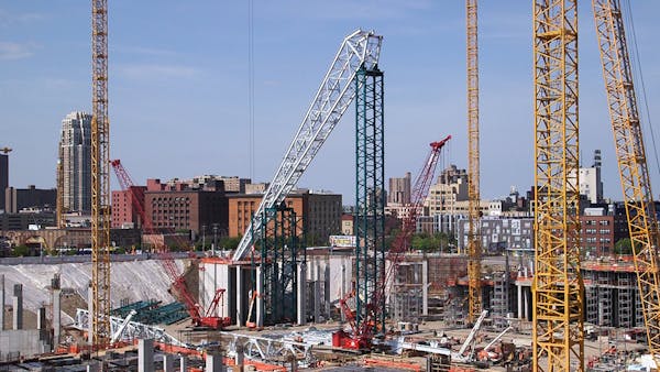 Steel structures being placed to hold up Vikings stadium roof