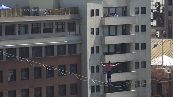 French tightrope walker tiptoes over Santiago