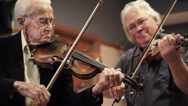 100-year-old surprised at birthday party, plays violin with idol
