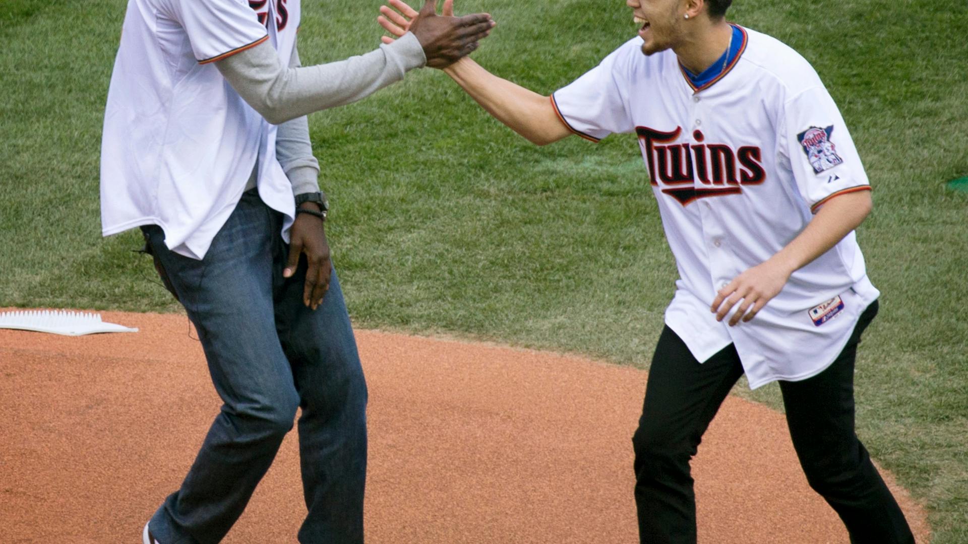 Duke guard and Apple Valley product Tyus Jones participated in the first pitch of the Twins home opener on Monday, joining outfielder Torii Hunter and Wolves forward Kevin Garnett at Target Field.