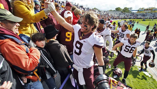 Gophers acting head coach Tracy Claeys is victorious