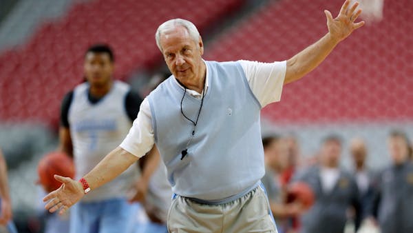 Roy Williams signs autographs; players talk at Final Four