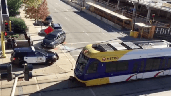 Van collides with a light-rail train