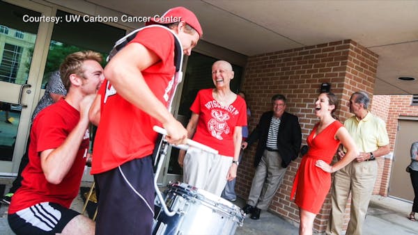 UW Marching Band members surprise cancer patient