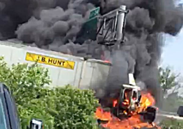 Truck driver rescued from fiery crash