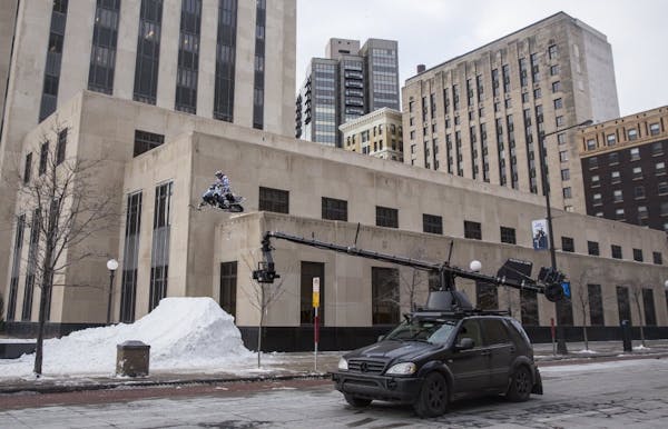 Snowmobile stunt closes off downtown St. Paul intersections