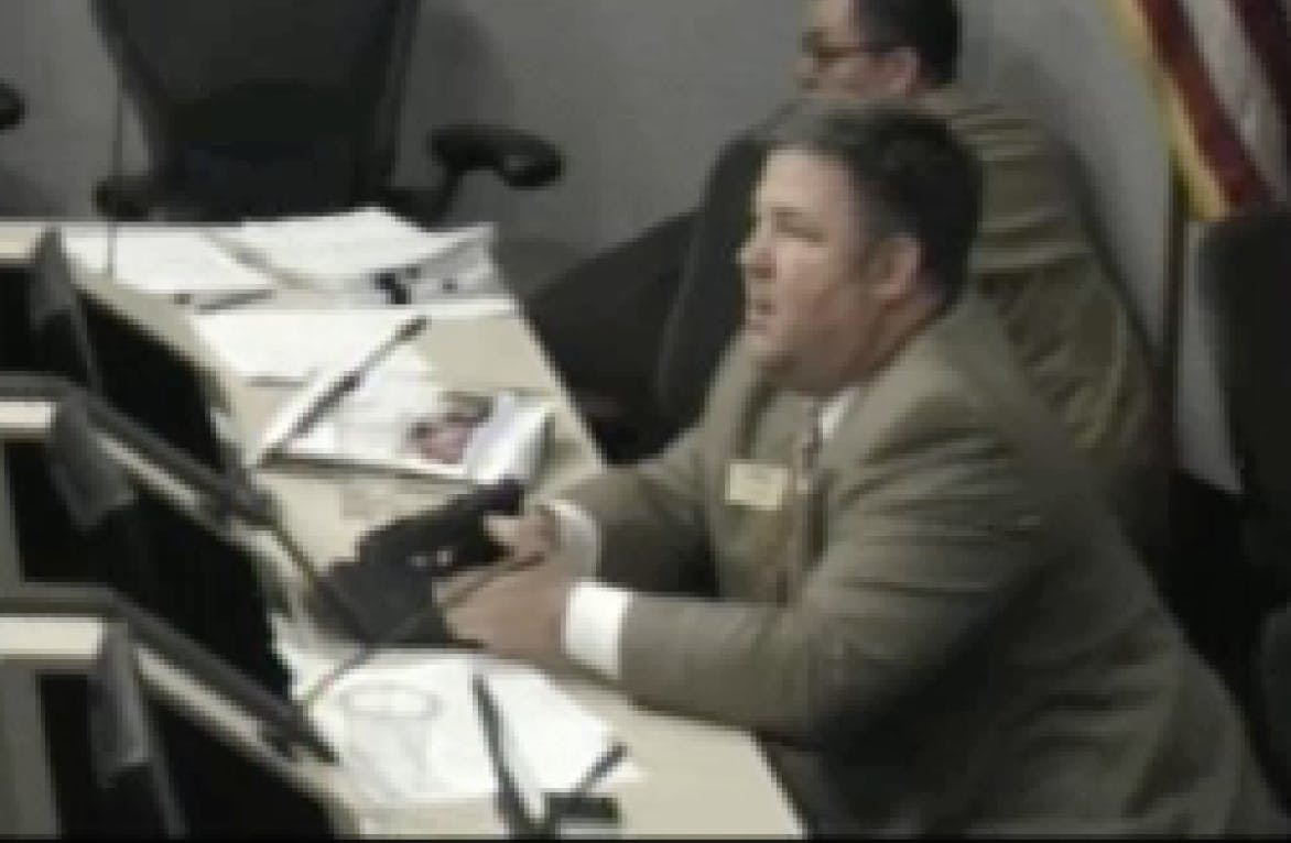 Community access video feed captured council members' reactions as gunfire interrupted a meeting in progress.