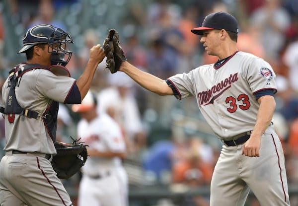 Milone gets first major league save