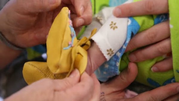 Baby moccasin program connects ritual to family