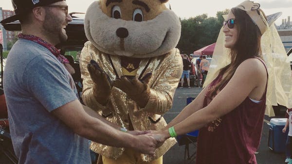 Goldy helps officiate wedding party at football season opener