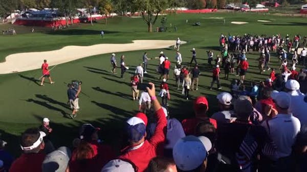 U.S. golfers opt for hugs, handshakes over wild celebration