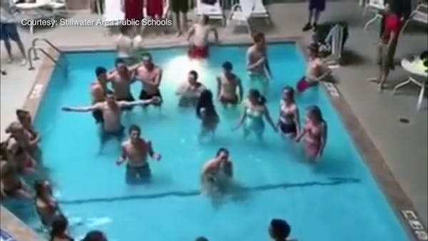Stillwater High choir surprises hotel guests with pool tune