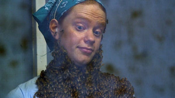 Fairgoers cringe at the sight of a beard made up of bees