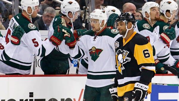 Wild hands defending champion Penguins first home loss of season