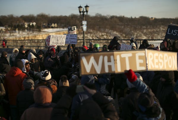 Protesters march for justice in police shootings on MLK Day