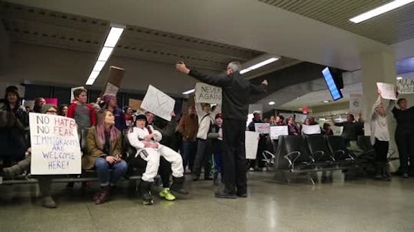 Protesters sing at MSP