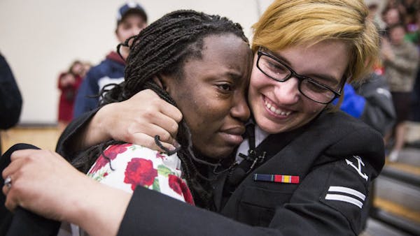 Military sister surprises siblings at high school
