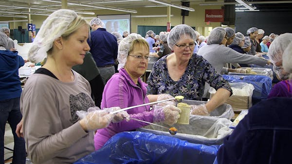 Snowstorm doesn't deter hundreds of volunteers packing meals