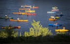 Canoes, kayaks and sailboats stage 'boat ballet'