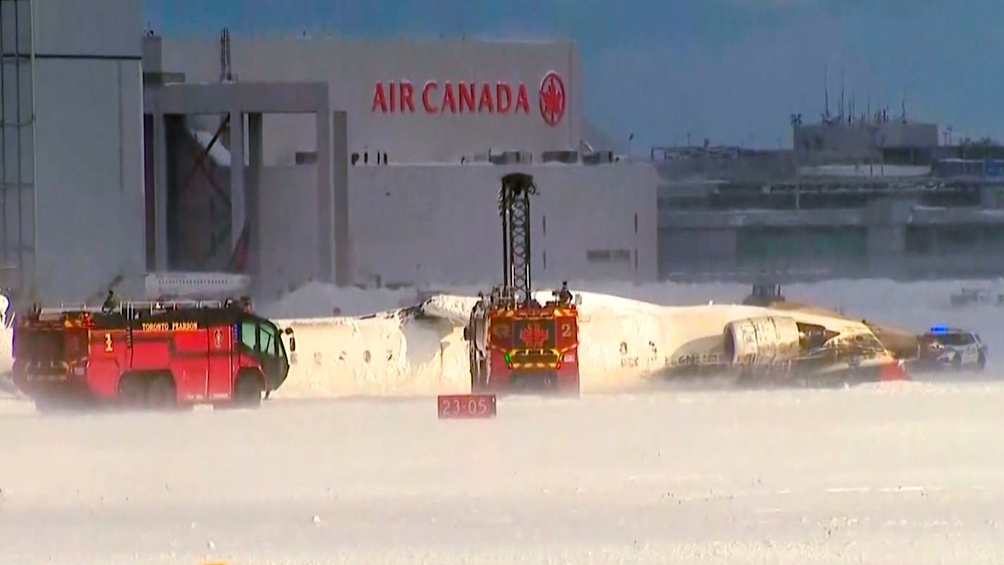 Delta jet ends up on roof after crash landing in Toronto