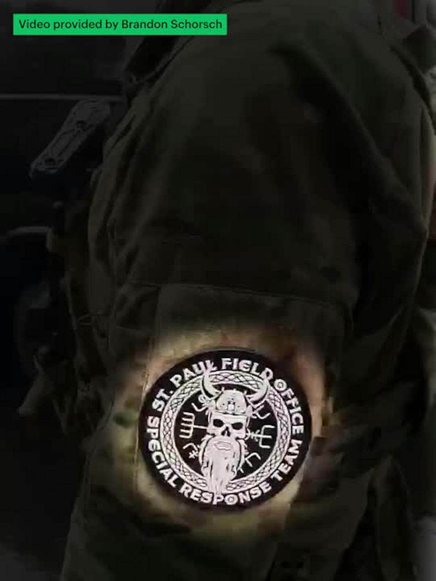 An ICE agent with a patch of the Norse god Odin (Video by Brandon Schorsch)