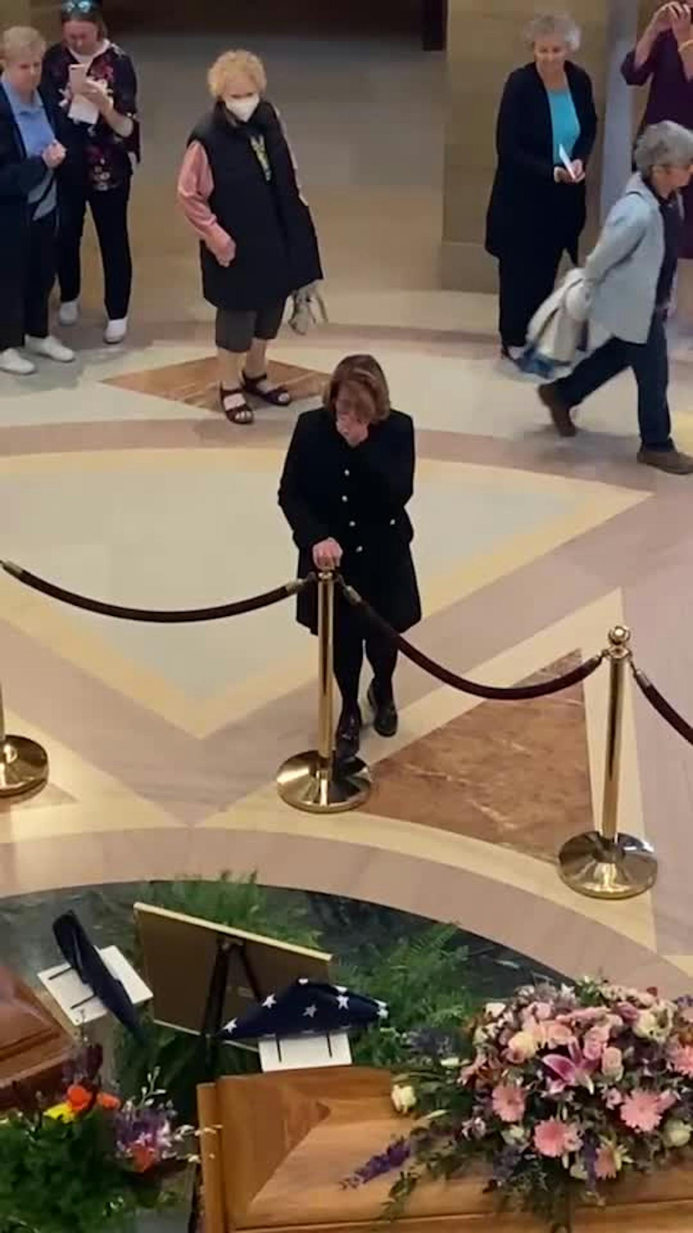 Senate Majority Leader Erin Murphy is overcome with emotion as she pays her respects to the Hortmans