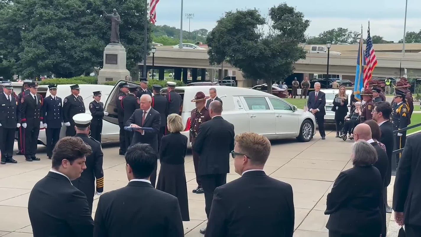 Gov. Walz presents flags to Hortman family after the funeral