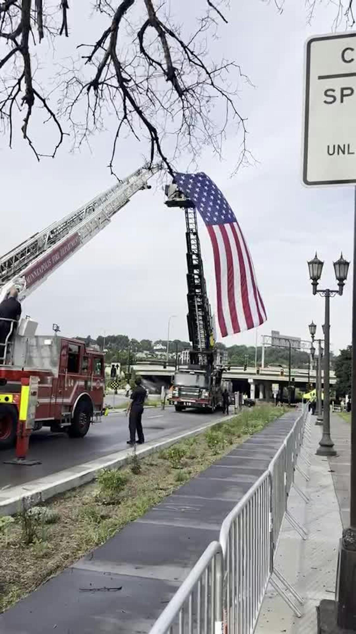A flag is raised outside the Minneapolis Basilica ahead of Hortman funeral Saturday