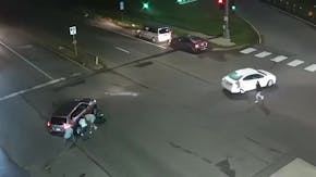 State traffic camera footage shows bystanders trying to aid a child hit by a car