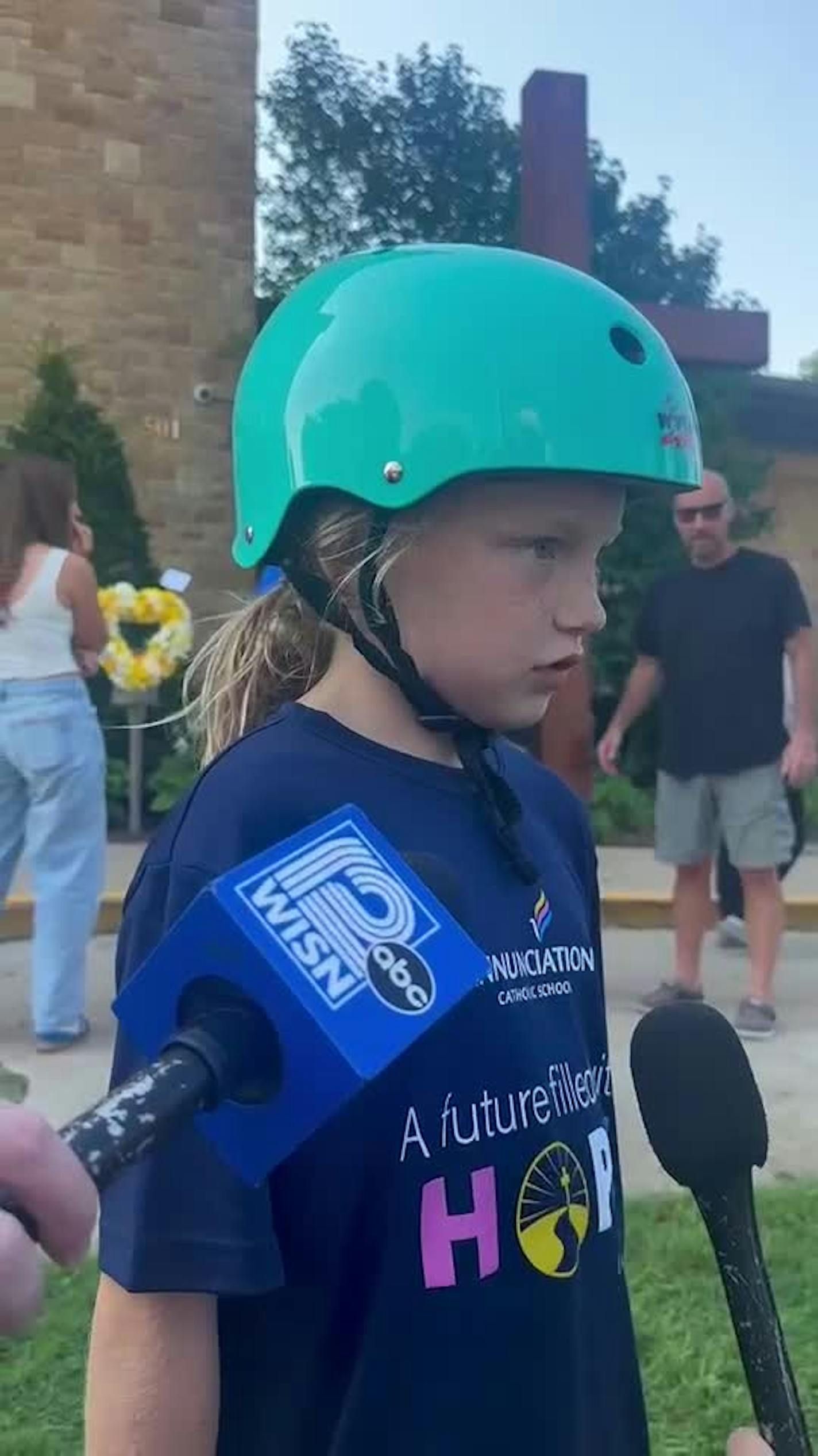 A third grade student at Annunciation named Rosie, discusses the shooting with members of the media