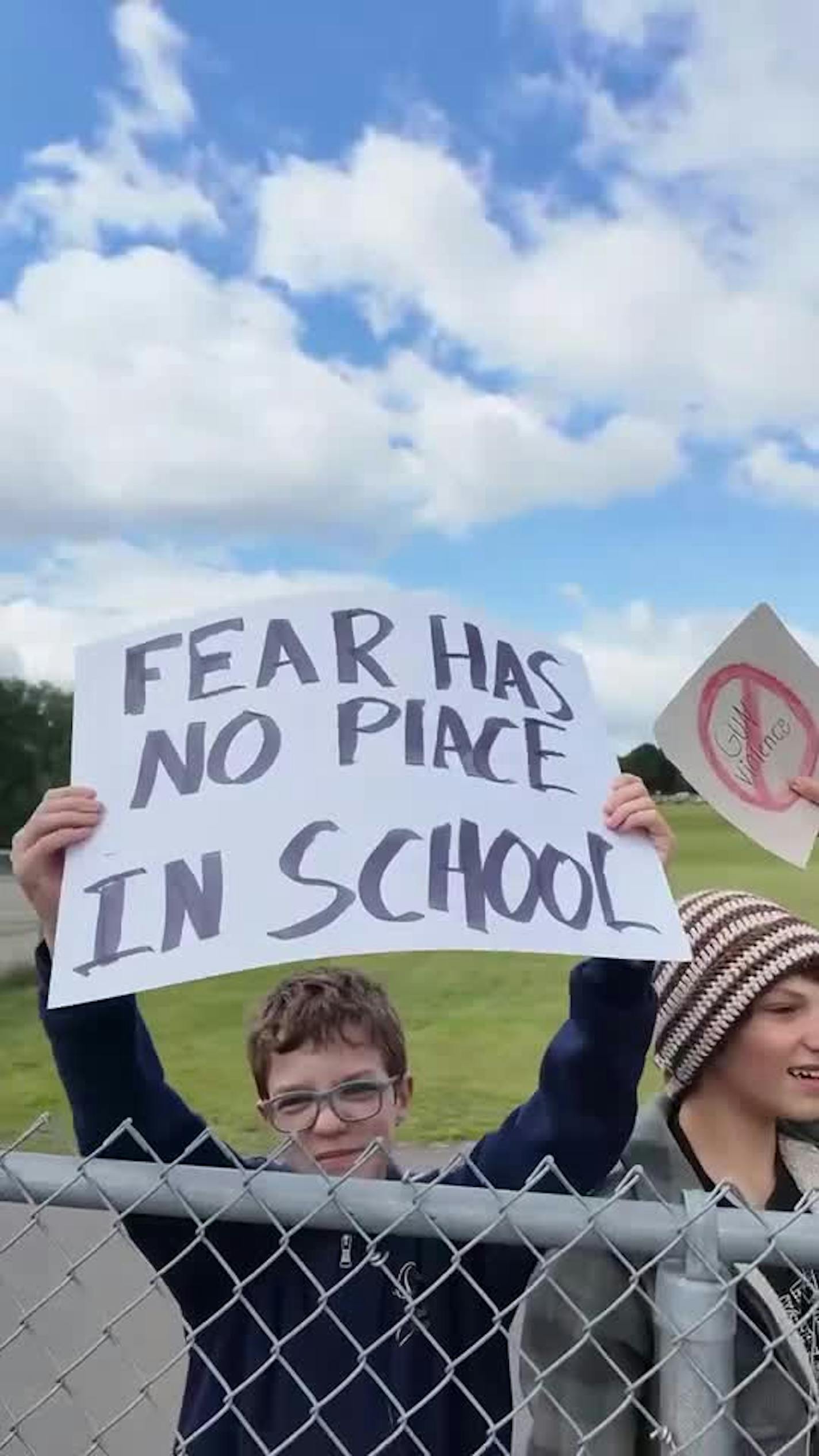 Kids line up at Parkview Center School in Roseville with signs calling for gun reform
