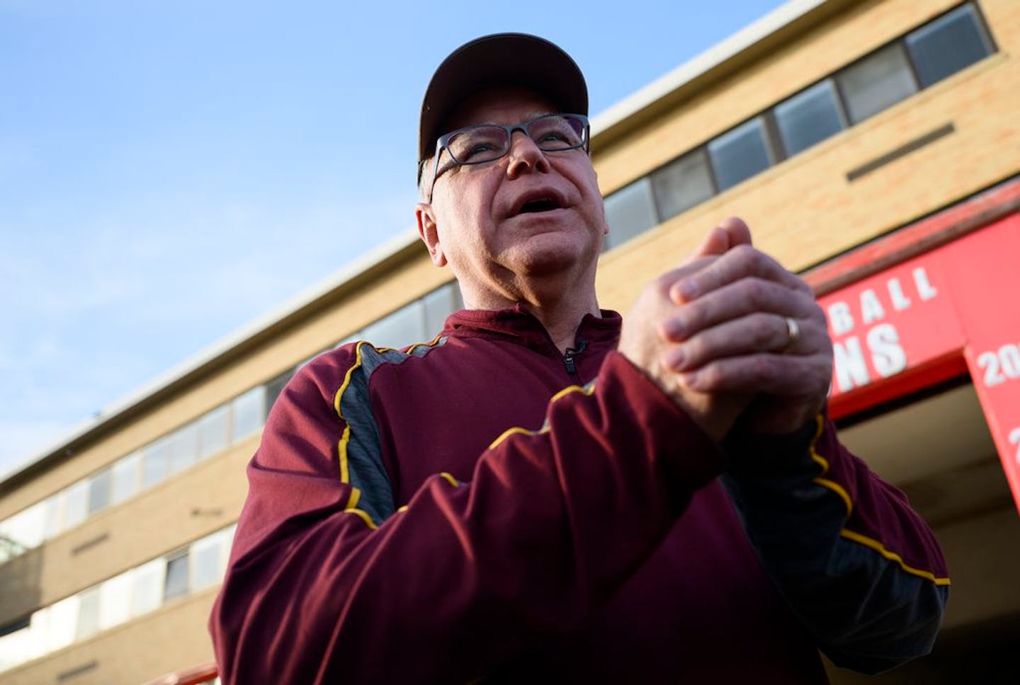 Walz greets players on the football team at Mankato West High School, where the vice presidential candidate was once a geography teacher and an assistant coach.